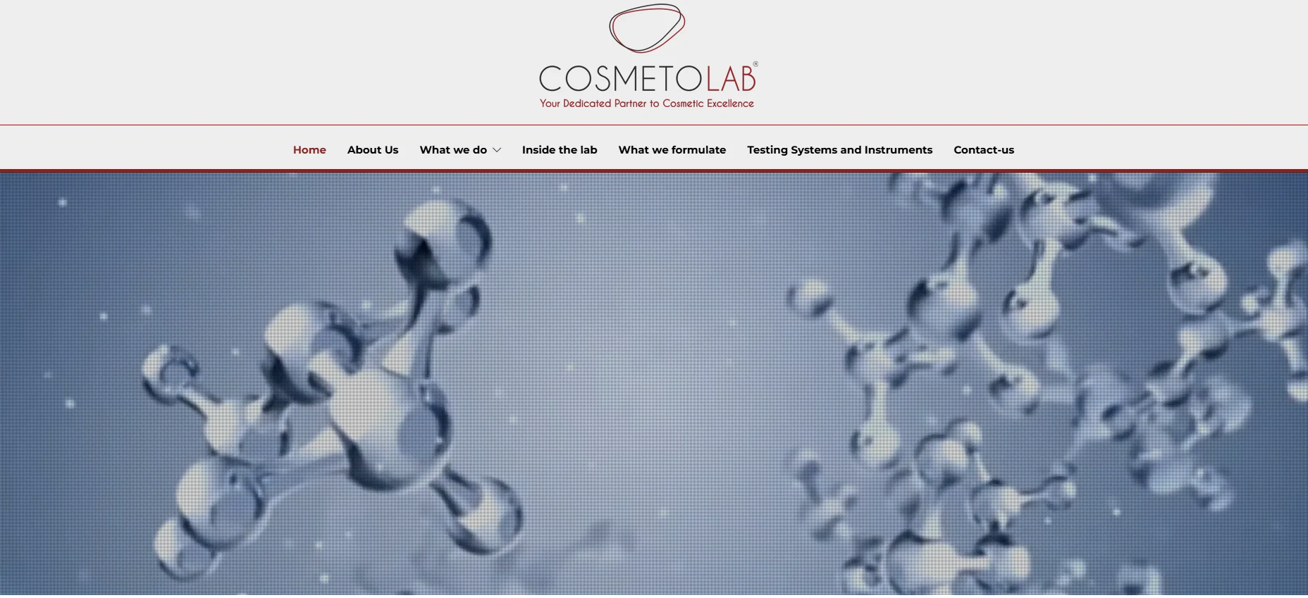 Cosmetolab website homepage featuring molecular structure imagery in blue and white tones above a navigation menu.